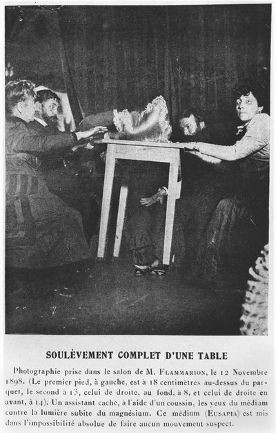A table levitating during a seance with Eusapia Palladino 12th November 1898 by French Photographer